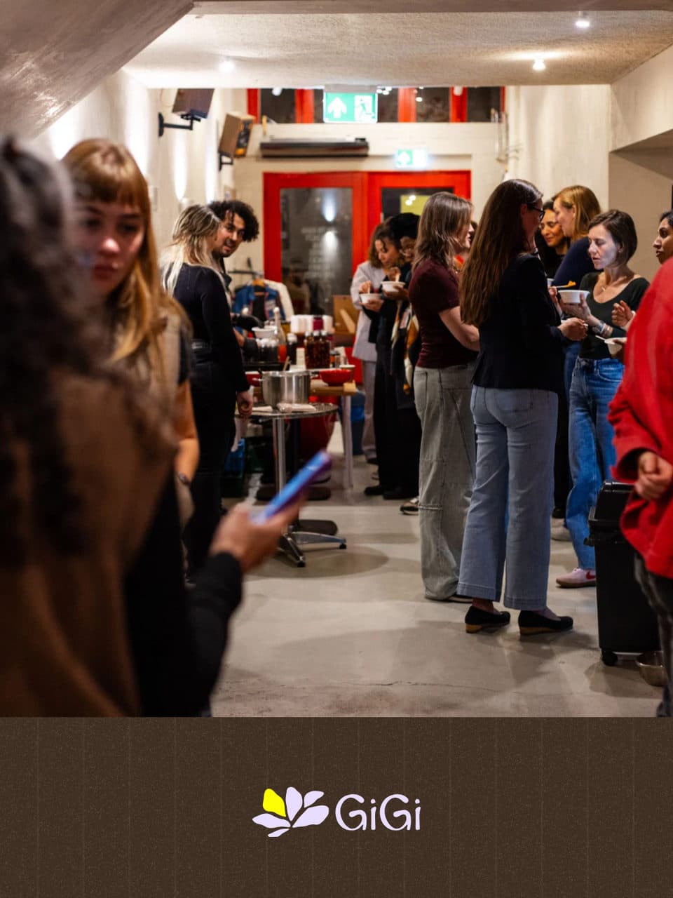 The hallway full of guests talking, cups of bone broth in their hands.